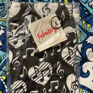 New in package Fabulegs music note leggings, size large